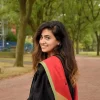 portrait-smiling-young-woman-standing-footpath_1048944-12542644 online university student